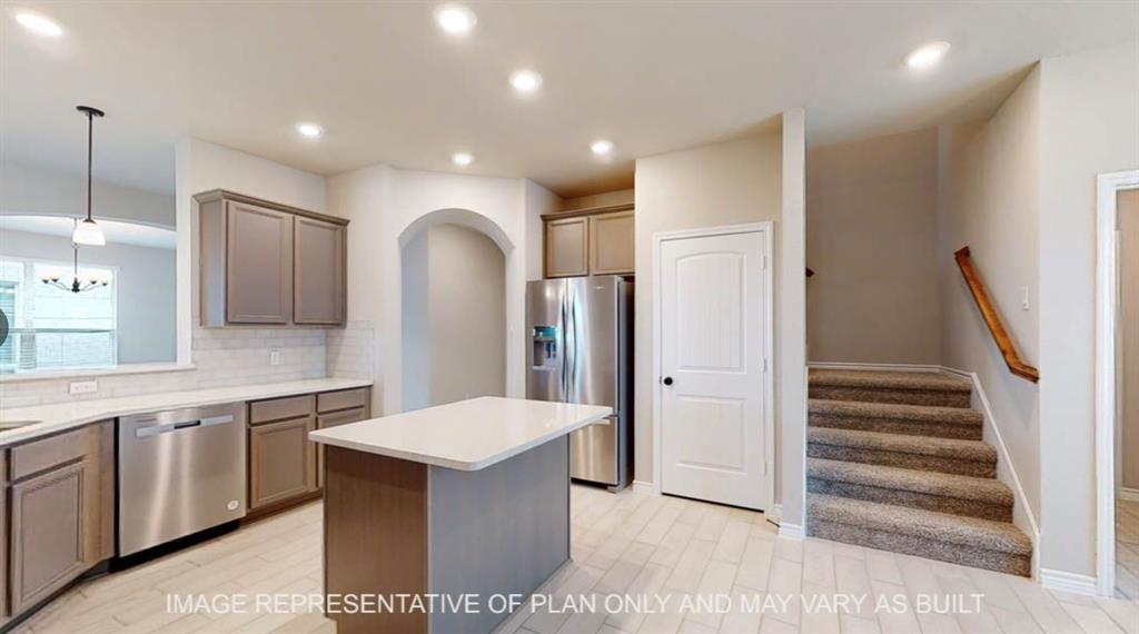 10720 Granada Drive Waco, TX 76708 - Photo 4 of 25 Kitchen featuring pendant lighting, a kitchen island, recessed lighting, stainless steel appliances, and backsplash