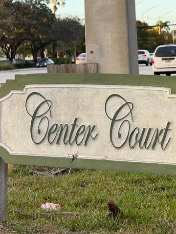 a view of a wooden fence and a sign board