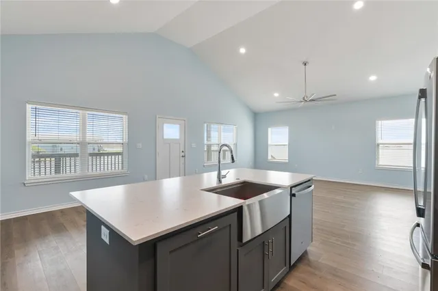 a bathroom with a double vanity sink a toilet and a mirror