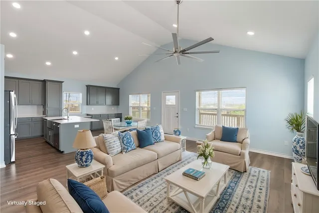 a bedroom with a large bed couch and a window