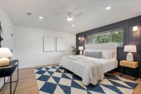 a bedroom with bed and a window