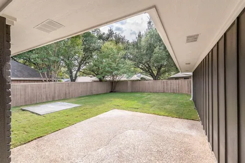 a view of a backyard with a garden and plants