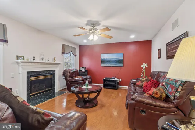 a view of a hallway with furniture and floor to ceiling window