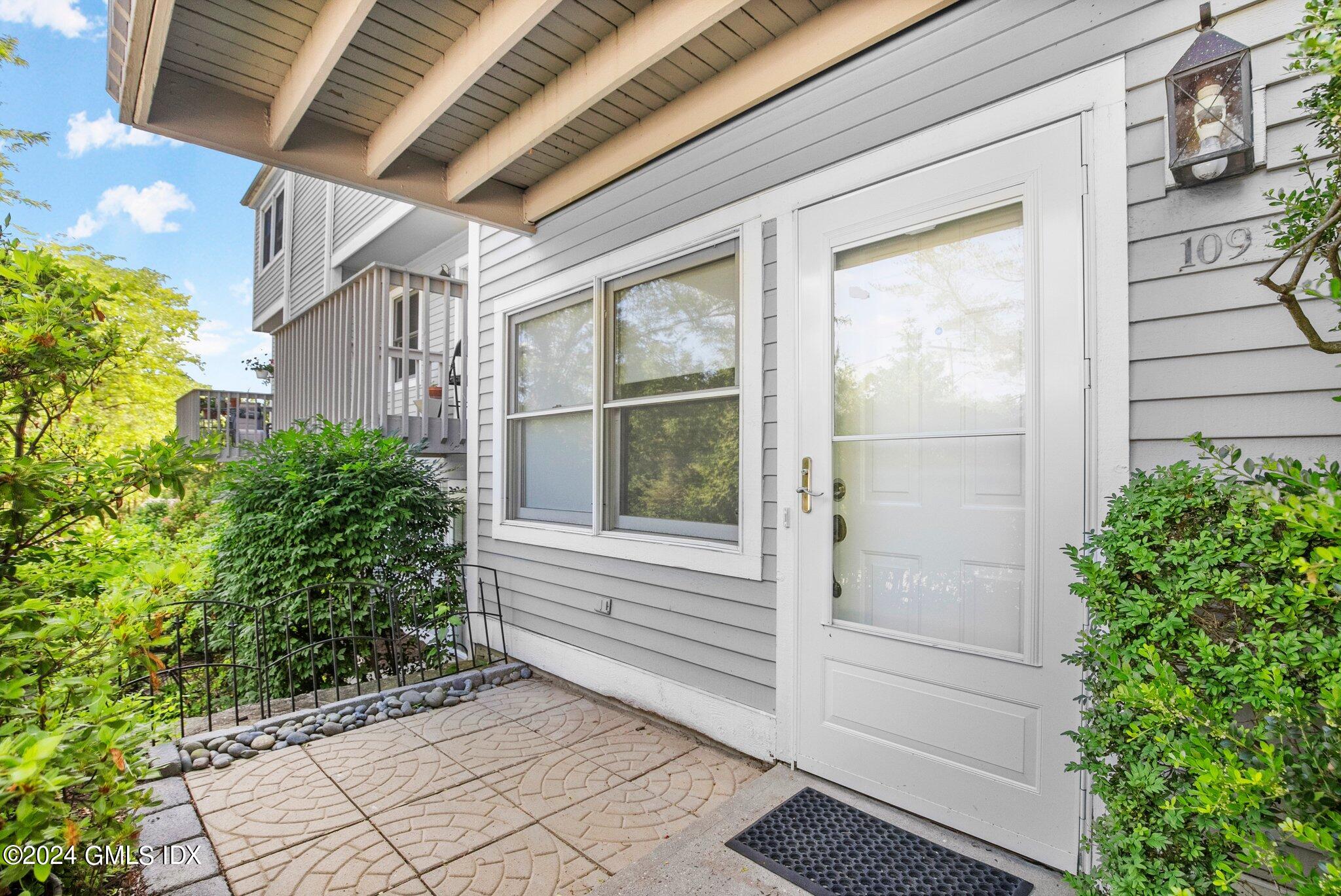 351 Pemberwick Road, Unit 109 Greenwich, CT 06831 - Photo 3 of 9 a view of house with backyard