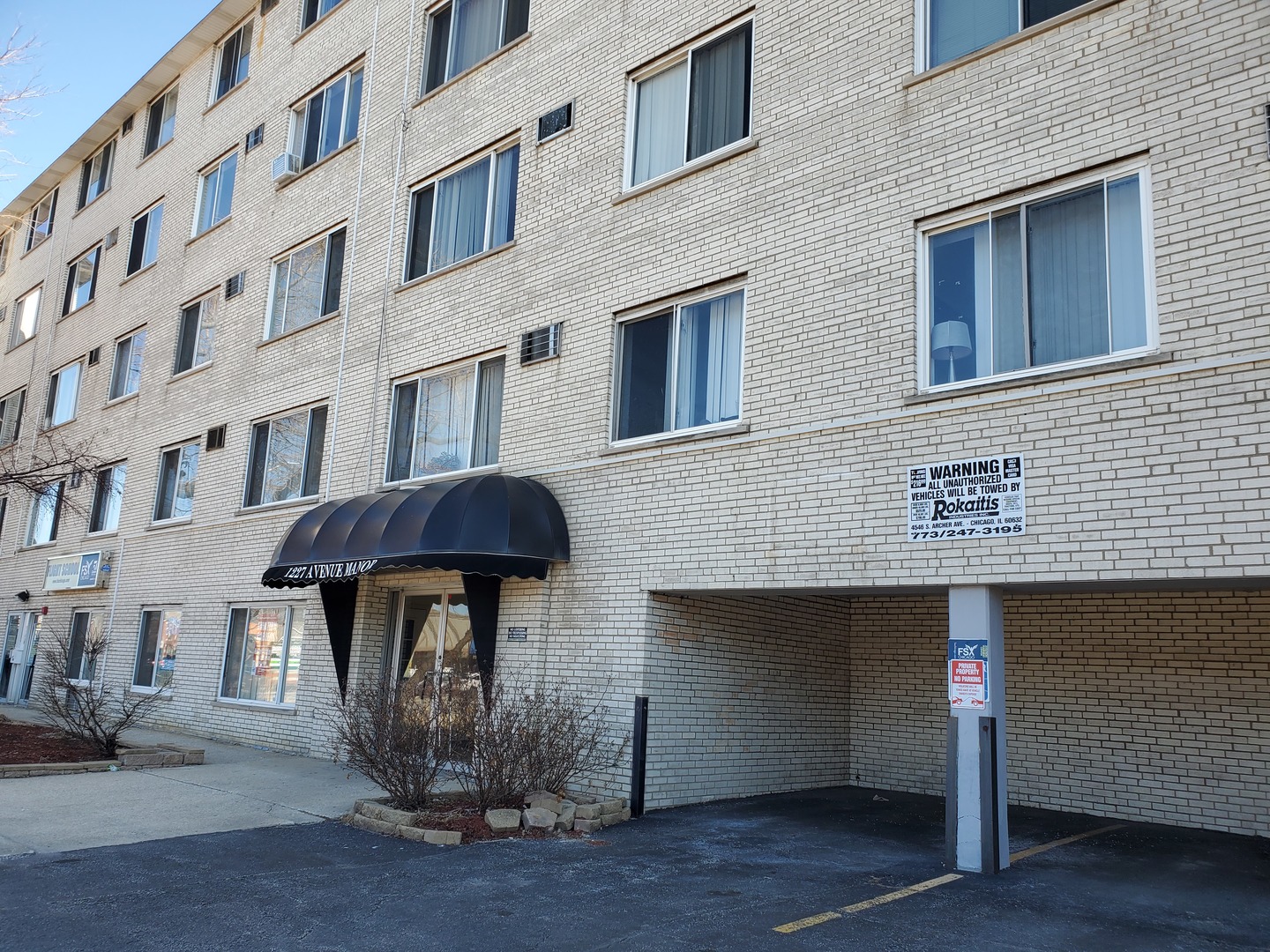 a front view of a building with an outdoor space