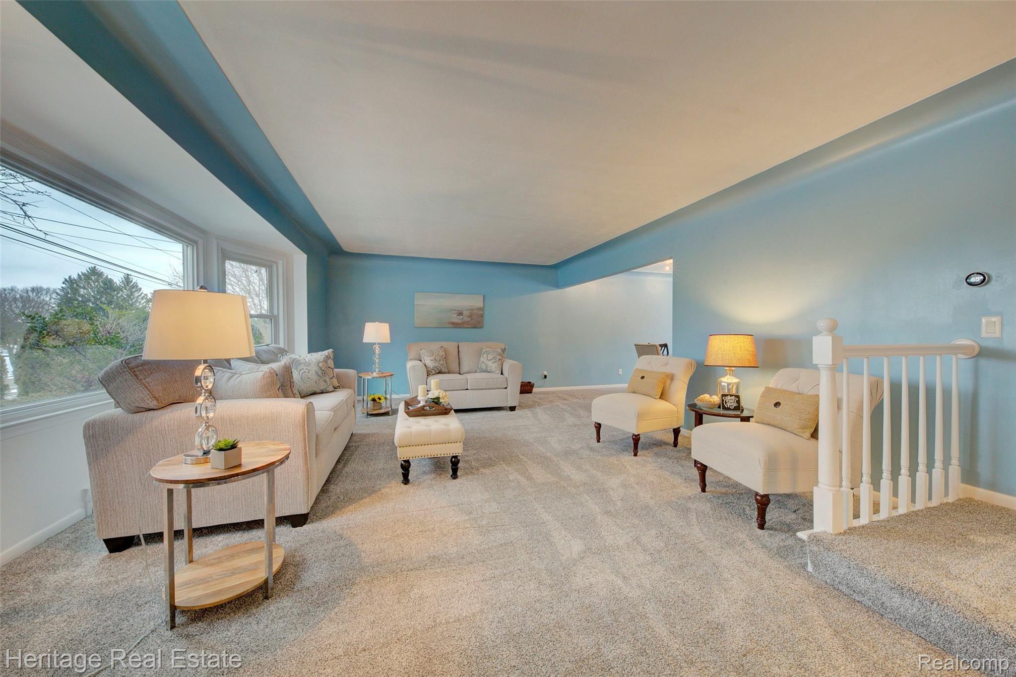 654 Old Perch Road Rochester, MI 48309 - Photo 6 of 61 Living room is very spacious and features a large bay window, brand new carpet and a cove ceiling.