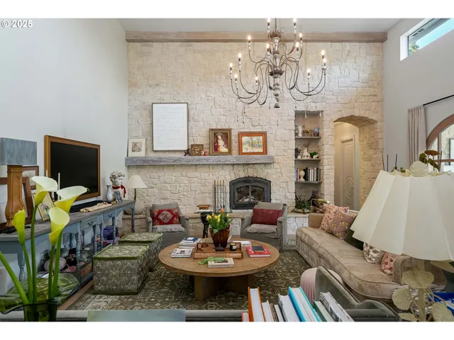 a view of a dining room with furniture and a fireplace
