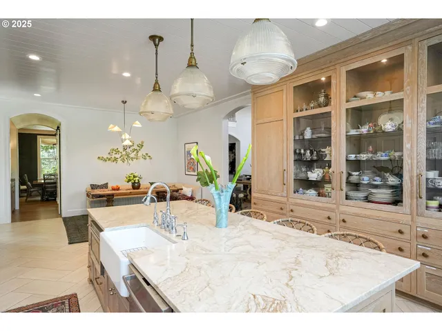 a view of a living room and kitchen