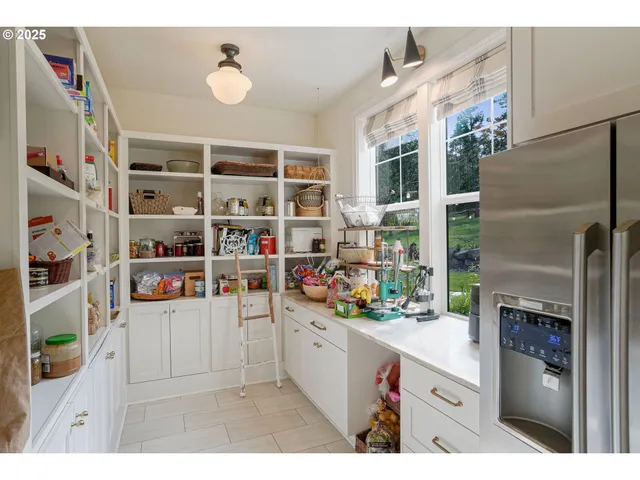 a view of a kitchen with furniture and chandelier