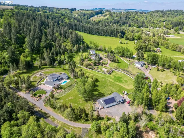 an aerial view of residential house with outdoor space and street view