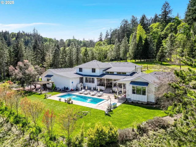 a bathroom with a double sink shower and a mirror