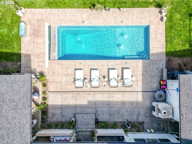 a front view of a house with plants