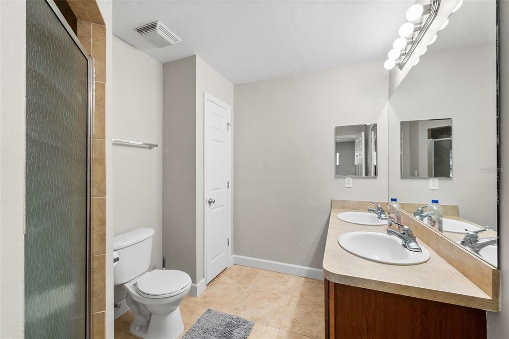 2927 Southwest 35th Place, Unit 113 Gainesville, FL 32608 - Photo 19 of 27 a bathroom with a sink toilet and shower