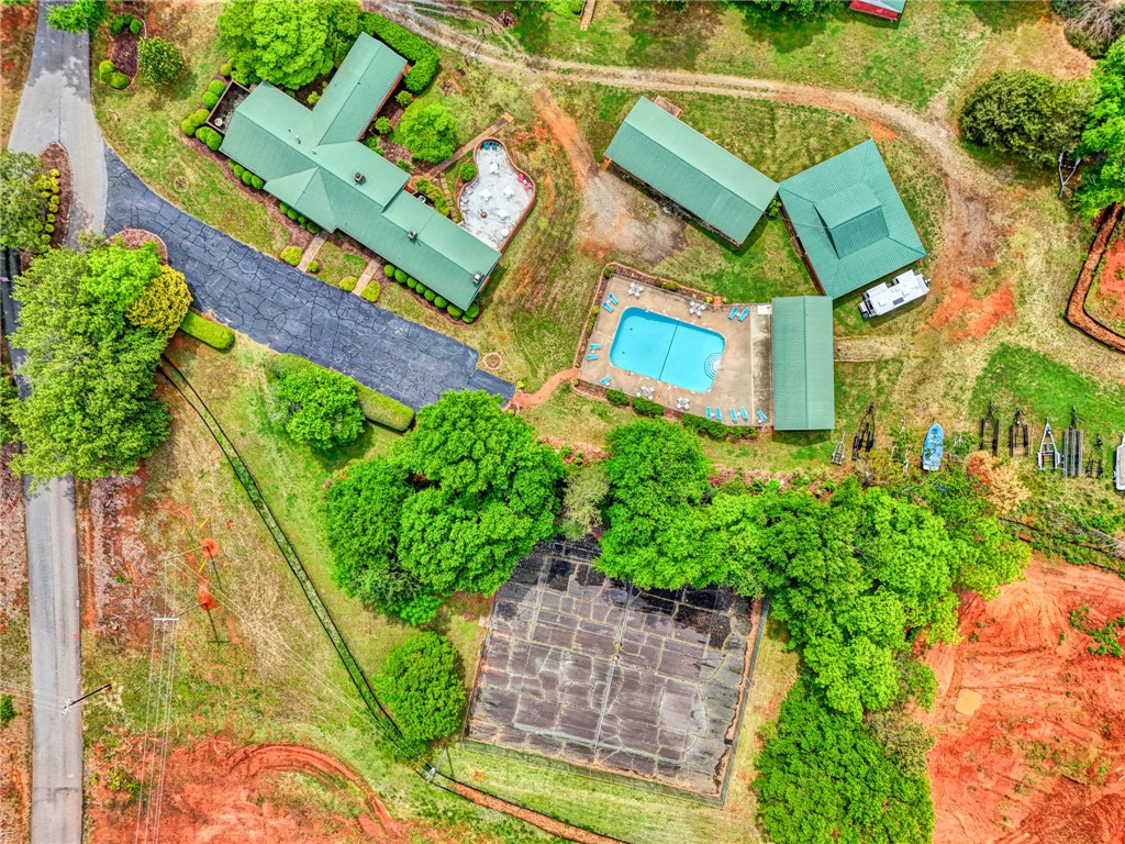 104 Captains Way Anderson, SC 29625 - Photo 27 of 47 This expansive estate features multiple structures, a swimming pool, and recreational amenities amidst lush landscaping.