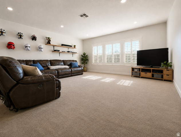 283 South Buffalo Ranch Road Farmington, UT 84025 - Photo 7 of 10 Spacious room featuring neutral carpeting, recessed ceiling lighting, and a window wall with white louvered shutters