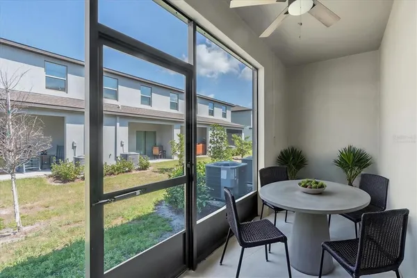 a view of a dining room with furniture window and outside view