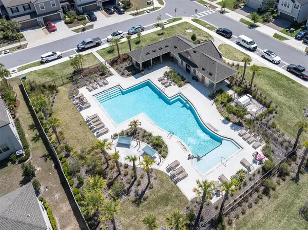 an aerial view of a house with a swimming pool