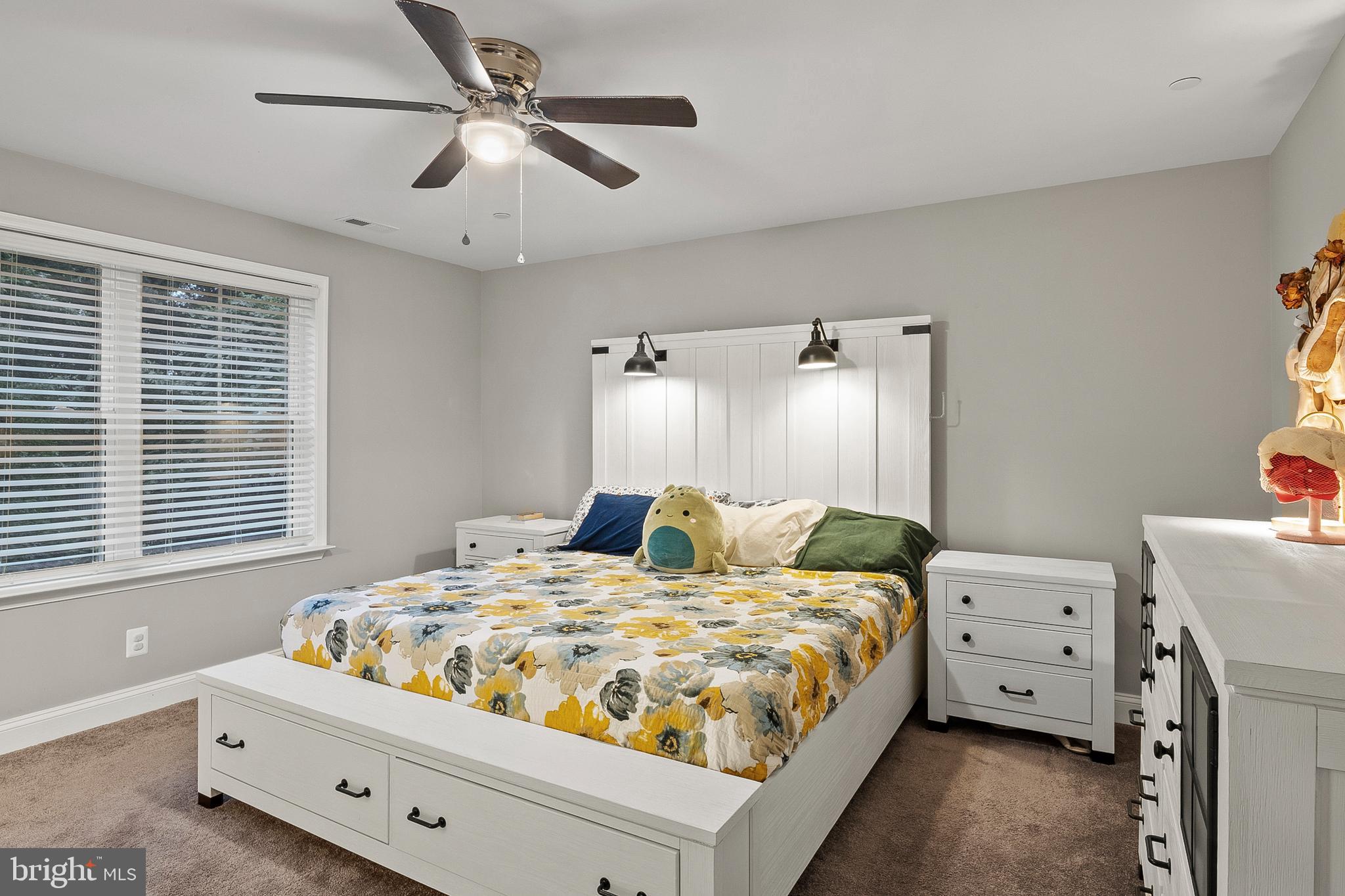 898 Marigold Road Glen Burnie, MD 21060 - Photo 15 of 33 a bedroom with a bed and a chandelier