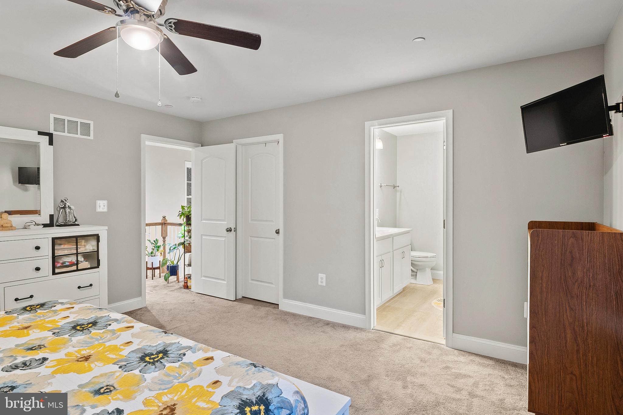 898 Marigold Road Glen Burnie, MD 21060 - Photo 17 of 33 a bedroom with a bed and a flat screen tv