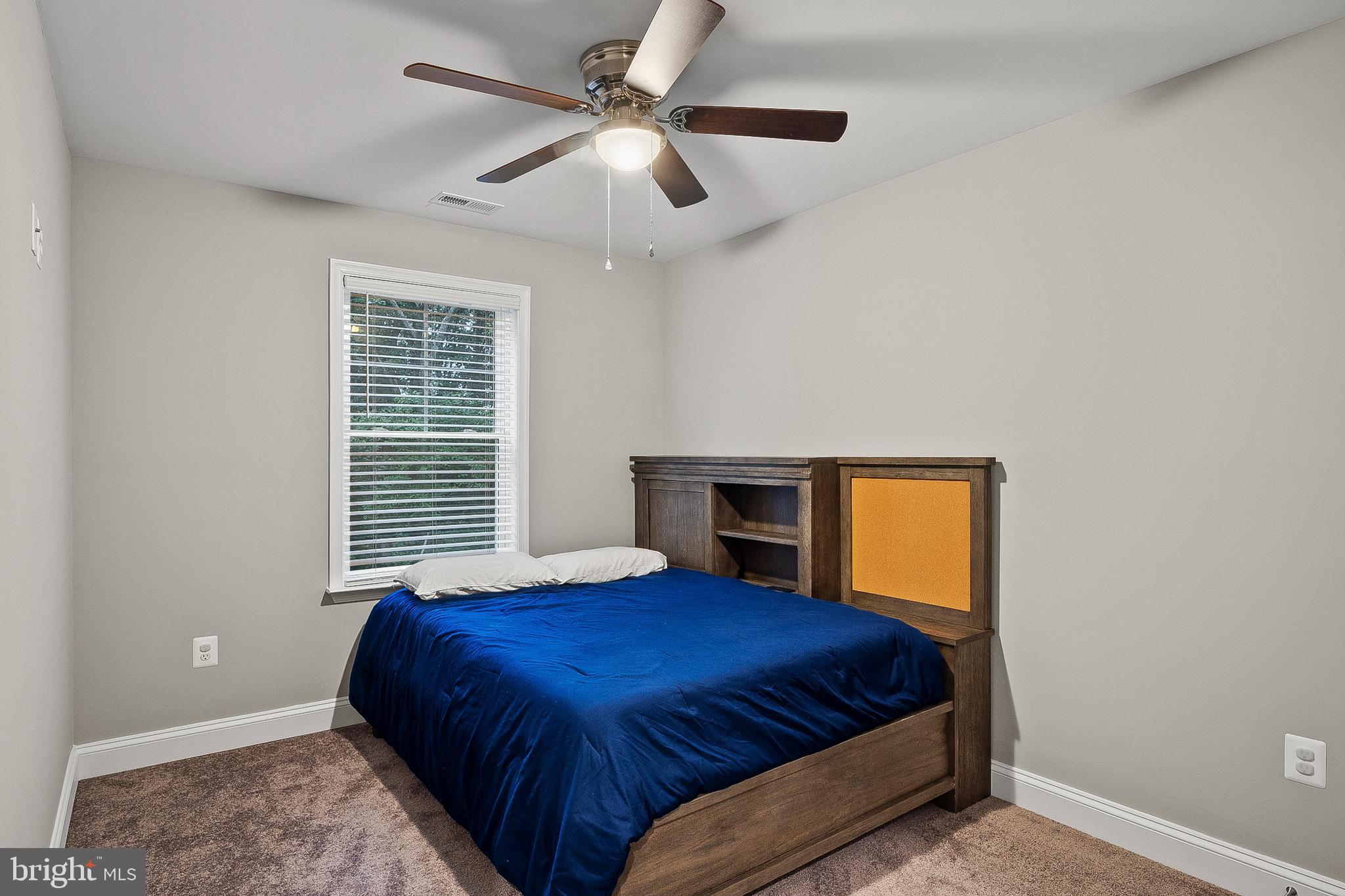 898 Marigold Road Glen Burnie, MD 21060 - Photo 22 of 33 a bedroom with a bed and a ceiling fan