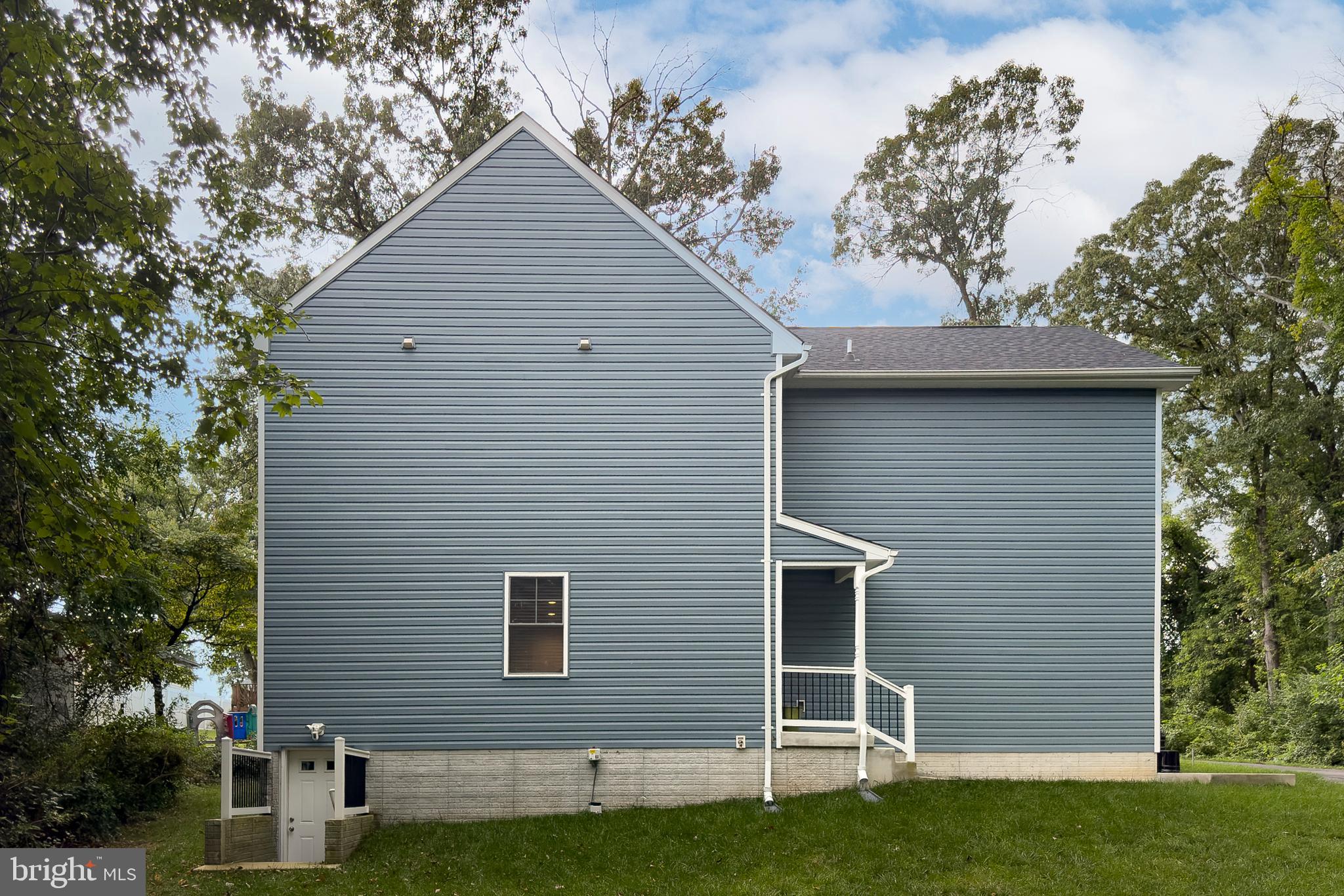 898 Marigold Road Glen Burnie, MD 21060 - Photo 28 of 33 a front view of a house with a garden
