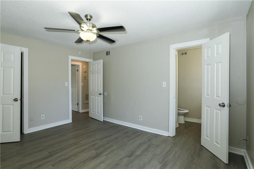 2055 Alison Court Southwest, Unit 8 Atlanta, GA 30311 - Photo 8 of 12 a view of an empty room with wooden floor