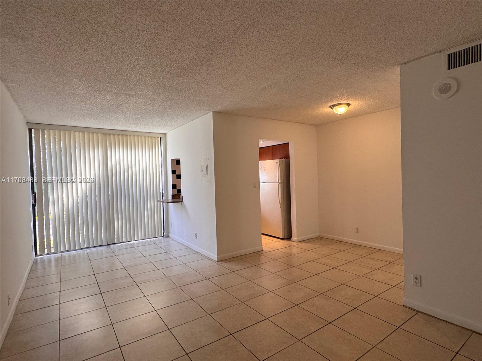 16919 North Bay Road, Unit 117 Sunny Isles Beach, FL 33160 - Photo 5 of 20 a view of an empty room