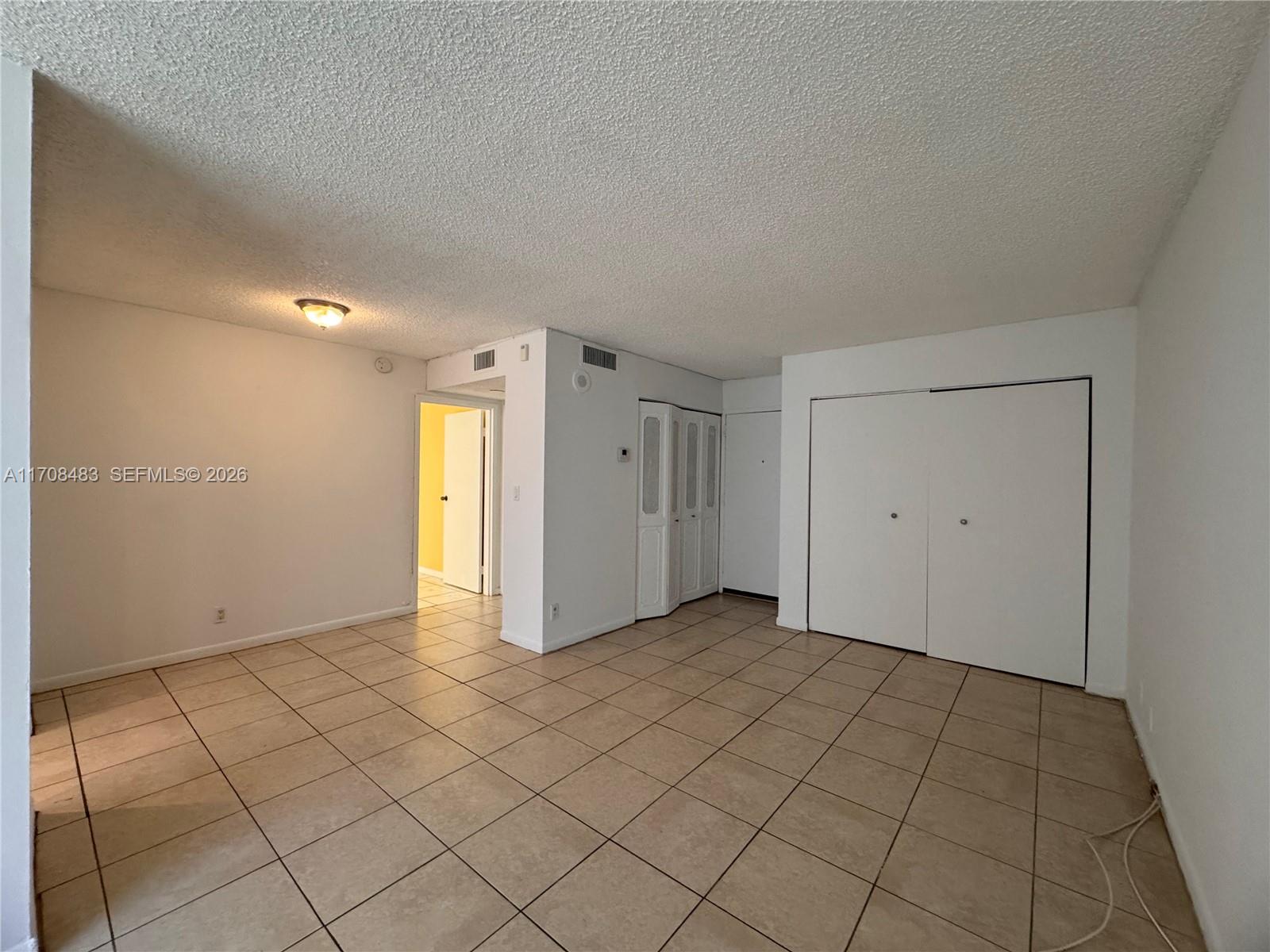 16919 North Bay Road, Unit 117 Sunny Isles Beach, FL 33160 - Photo 10 of 20 a view of an empty room and window