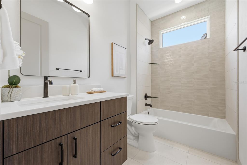 1063 Southwest 135th Way Newberry, FL 32669 - Photo 20 of 42 a bathroom with a sink a toilet and shower