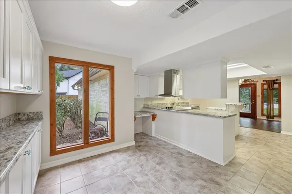 a kitchen with a sink and cabinets