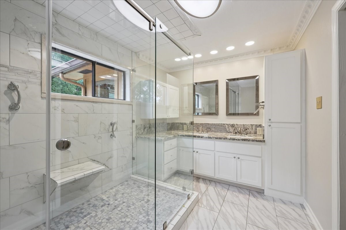 3805 Huntwick Street Orange, TX 77632 - Photo 14 of 43 a bathroom with a granite countertop sink mirror and shower