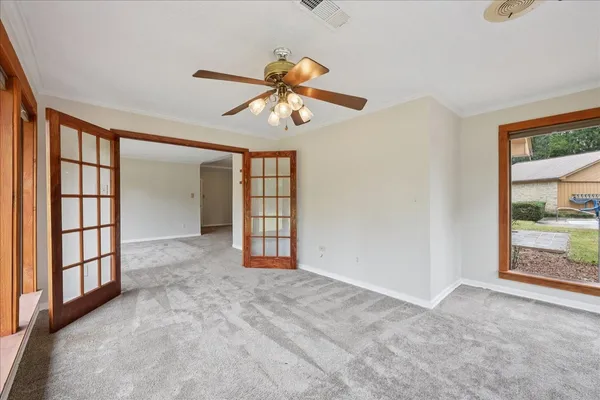 a view of an empty room with a window