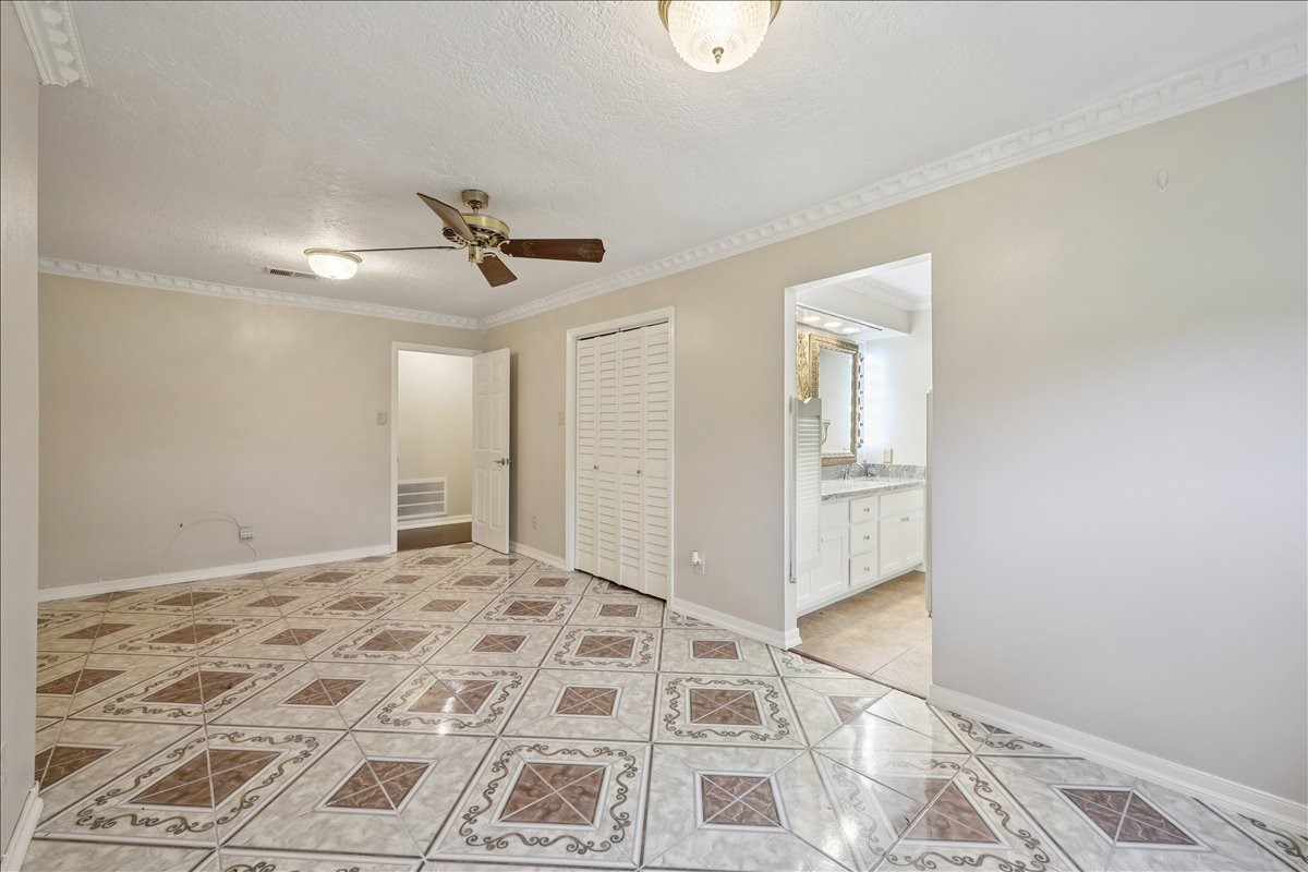 3805 Huntwick Street Orange, TX 77632 - Photo 20 of 43 a view of a livingroom with a chandelier fan and wooden floor