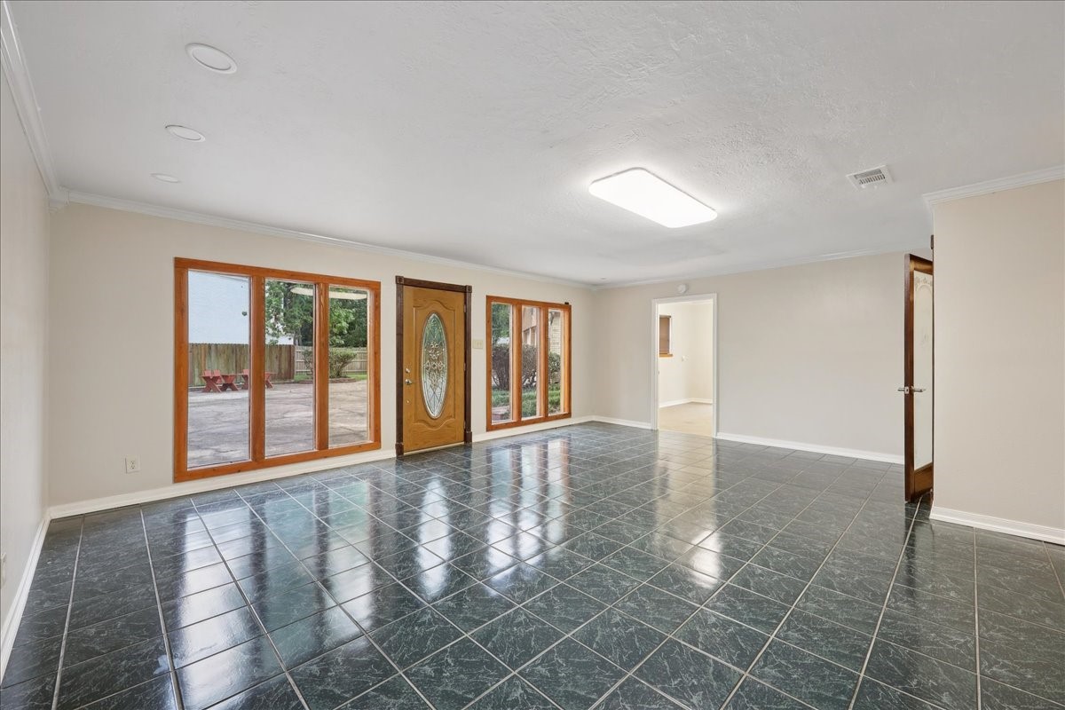 3805 Huntwick Street Orange, TX 77632 - Photo 28 of 43 wooden floor in an empty room with a window