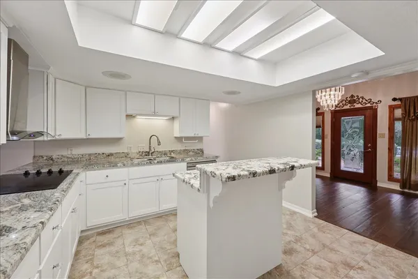 a kitchen that has a sink and a stove in it