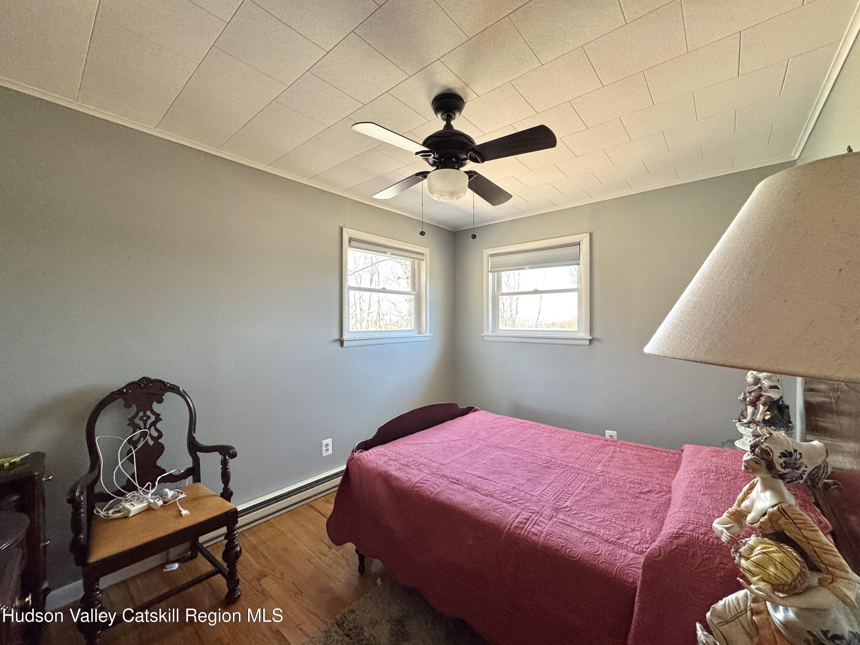 6339-6347 Highway 32 Catskill, NY 12413 - Photo 12 of 35 a bedroom with bed and a window