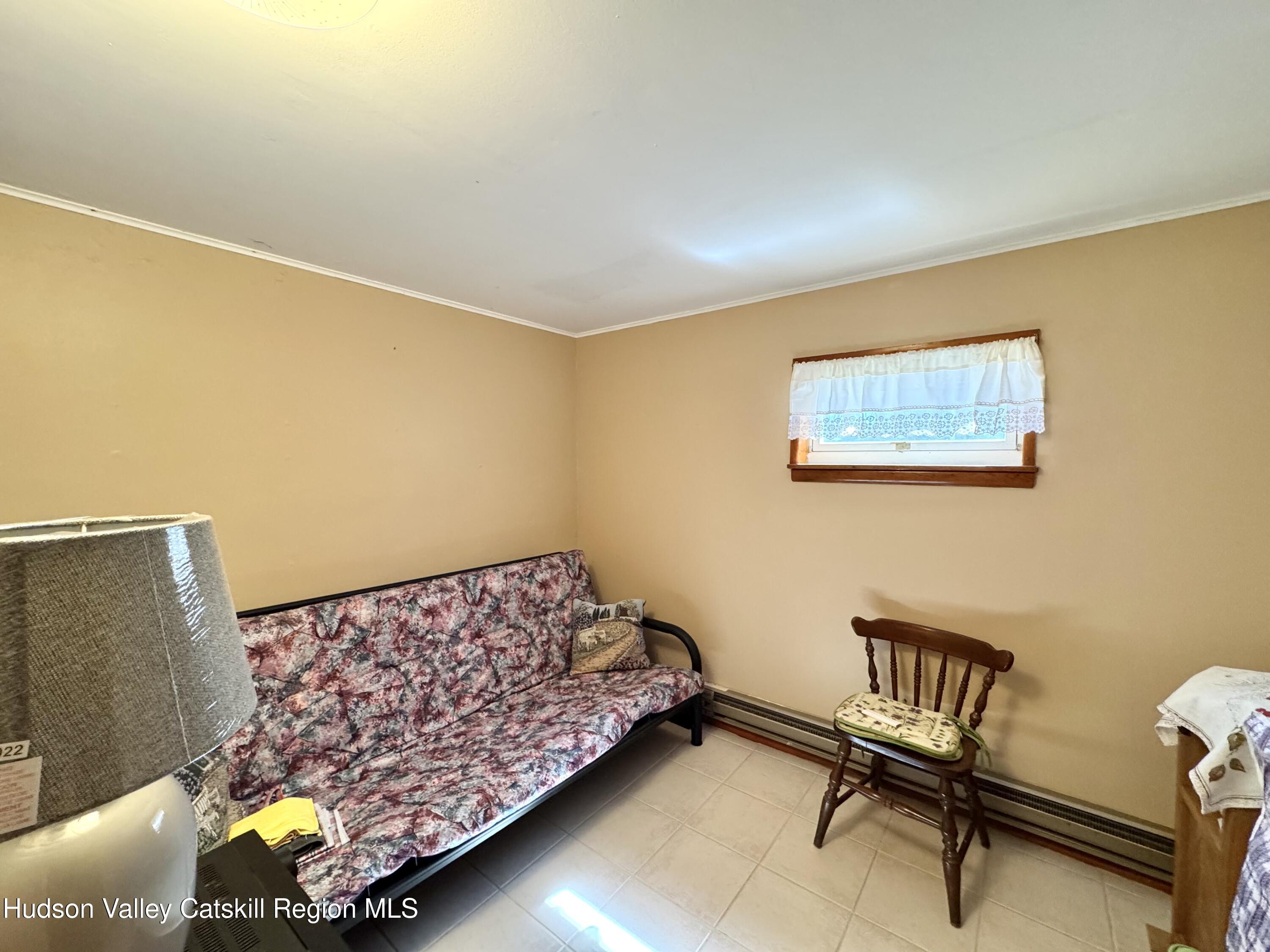 6339-6347 Highway 32 Catskill, NY 12413 - Photo 18 of 35 a bedroom with a bed and furniture