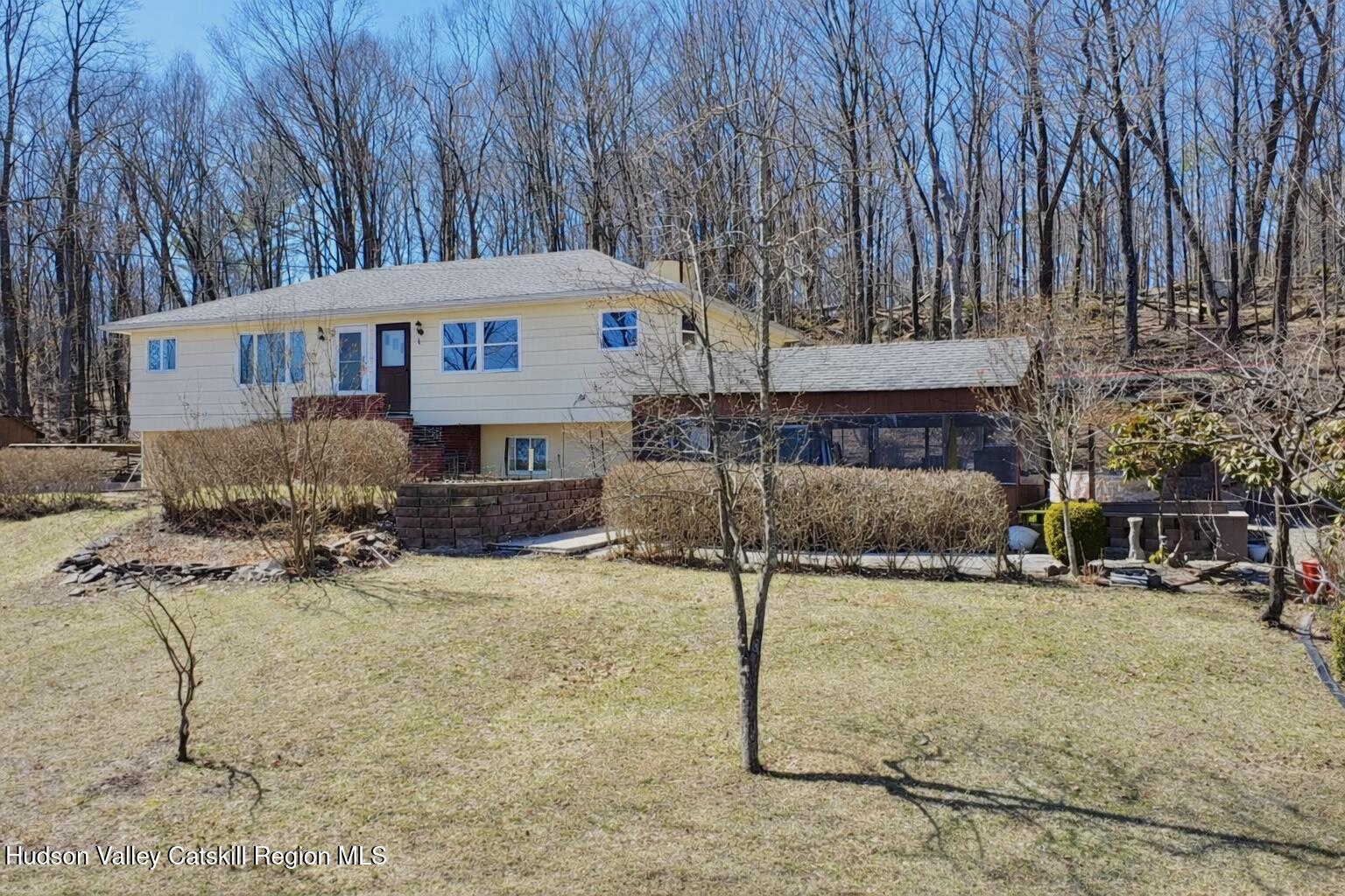 6339-6347 Highway 32 Catskill, NY 12413 - Photo 35 of 35 a front view of a house with a yard
