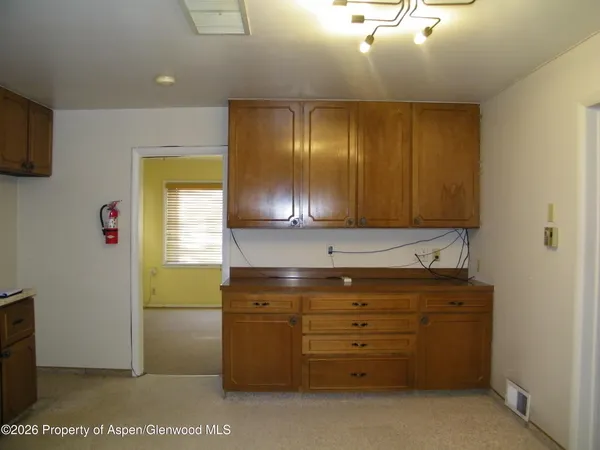 a view of a livingroom with wooden floor