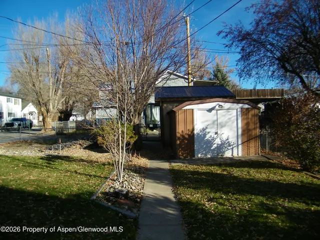 a view of a hallway with a room