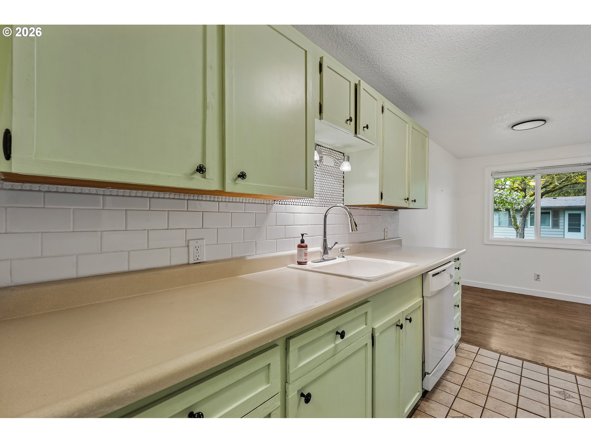 5566 Southwest Erickson Avenue Beaverton, OR 97005 - Photo 14 of 31 a kitchen with a sink and a window