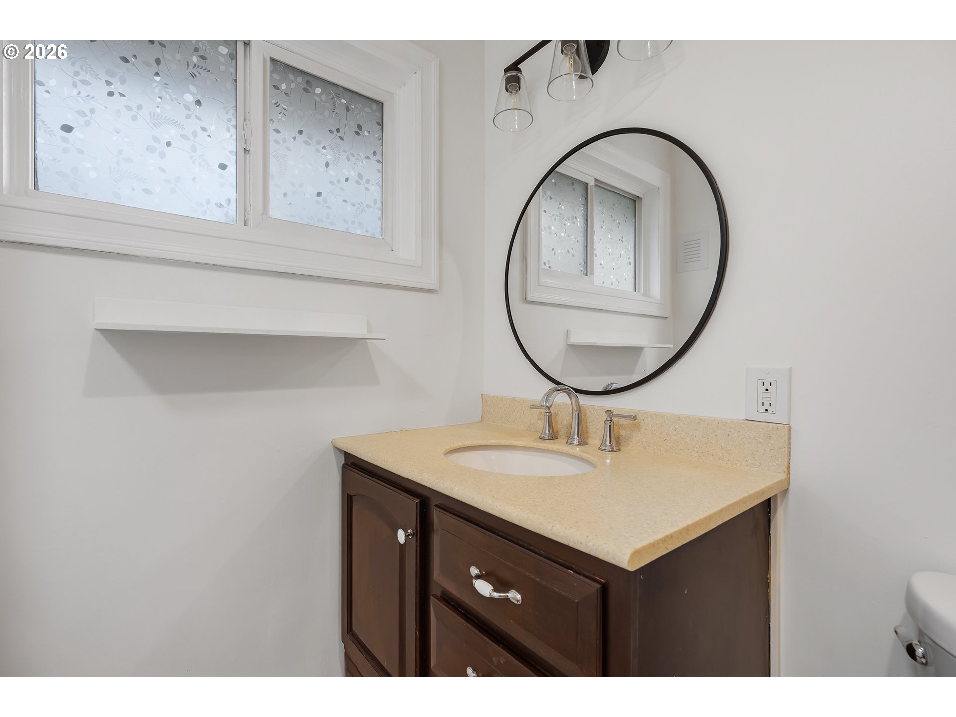 5566 Southwest Erickson Avenue Beaverton, OR 97005 - Photo 21 of 31 a bathroom with a sink and a mirror