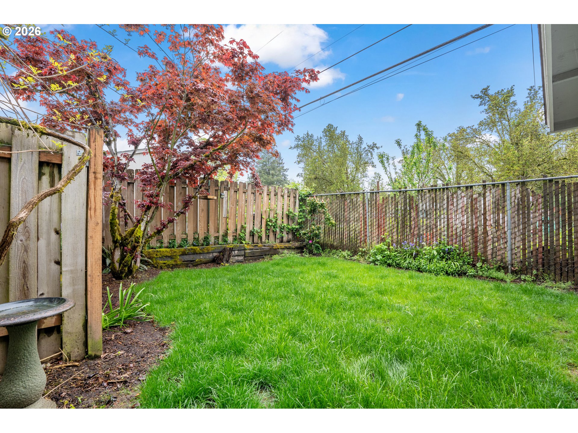 5566 Southwest Erickson Avenue Beaverton, OR 97005 - Photo 30 of 31 a view of backyard with garden and deck
