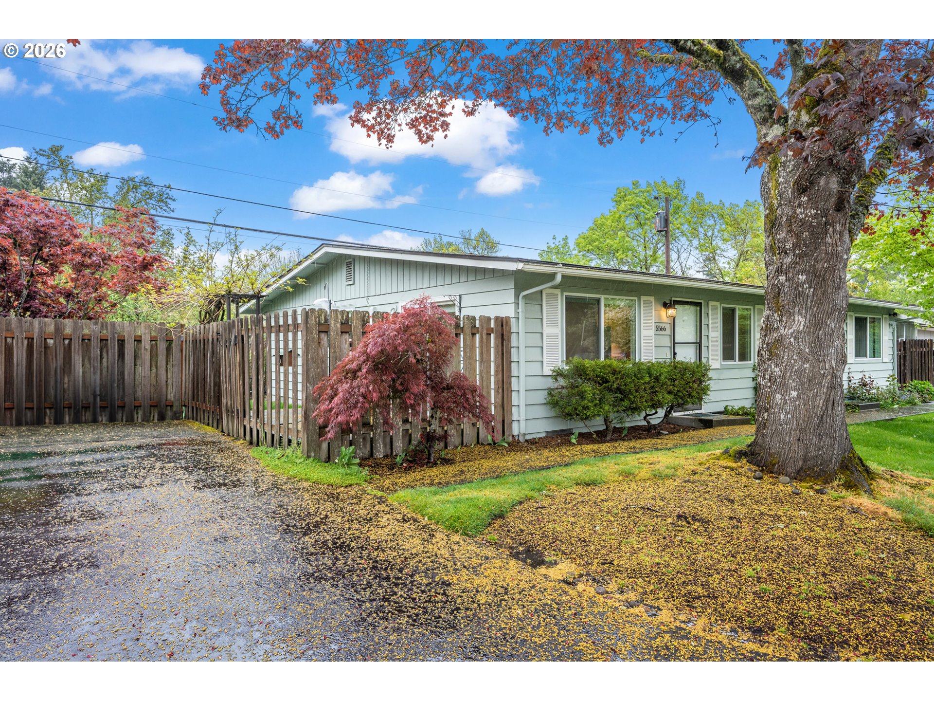 5566 Southwest Erickson Avenue Beaverton, OR 97005 - Photo 3 of 31 a view of a house with a yard
