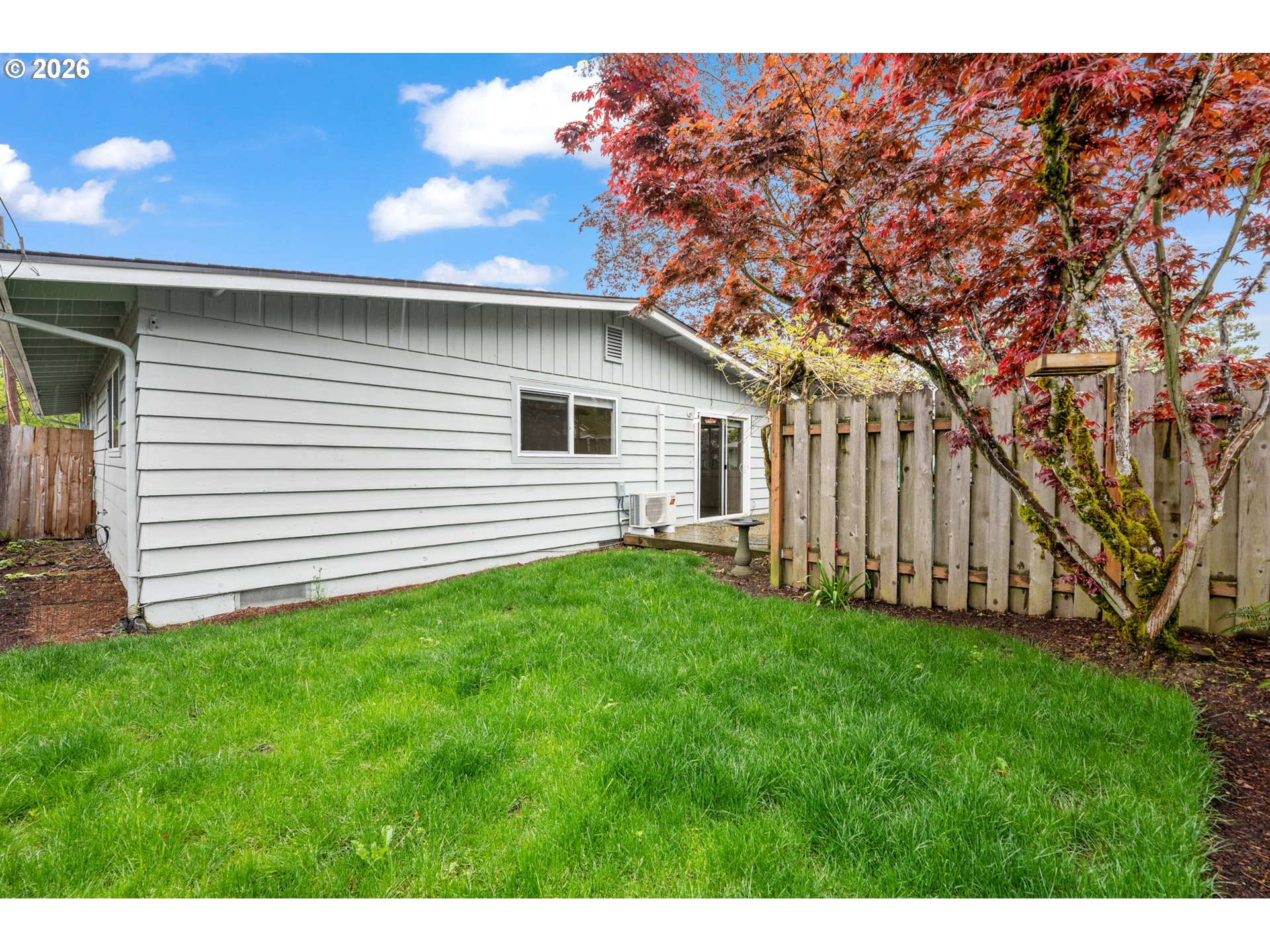 5566 Southwest Erickson Avenue Beaverton, OR 97005 - Photo 31 of 31 a view of a backyard with wooden fence