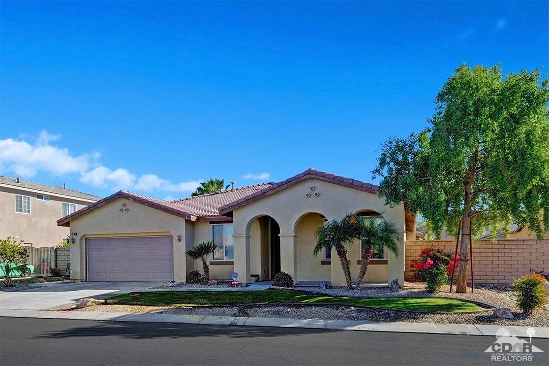 37388 Haweswater Road Indio, CA 92203 - Photo 1 of 28 a front view of a house with garden