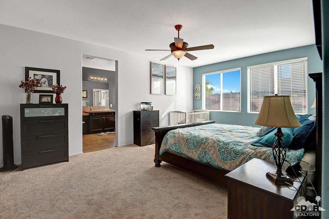 37388 Haweswater Road Indio, CA 92203 - Photo 12 of 28 a spacious bedroom with a bed and dresser