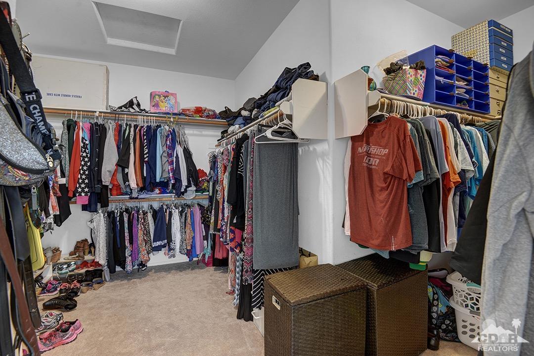 37388 Haweswater Road Indio, CA 92203 - Photo 15 of 28 a view of walk in closet with clothes