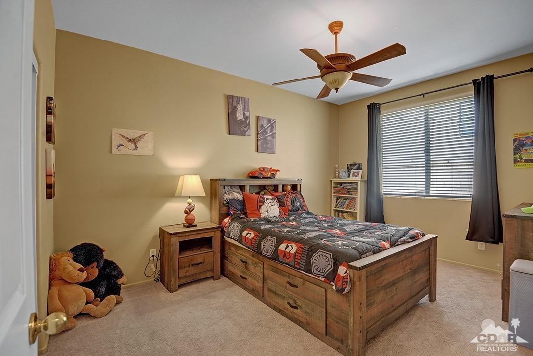 37388 Haweswater Road Indio, CA 92203 - Photo 19 of 28 a bed room with a bed and a window