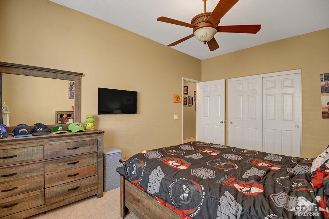 37388 Haweswater Road Indio, CA 92203 - Photo 20 of 28 a bedroom with a bed and a flat screen tv